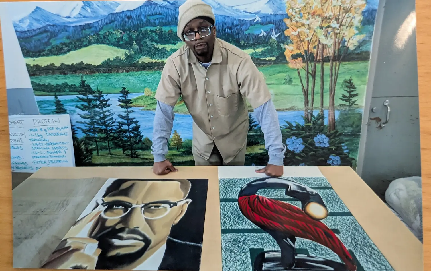 A photo of L leaning against two of his pieces placed on a table